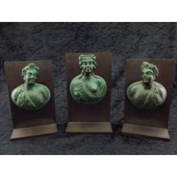 Set of three Roman bronze appliques of a noble women with tw